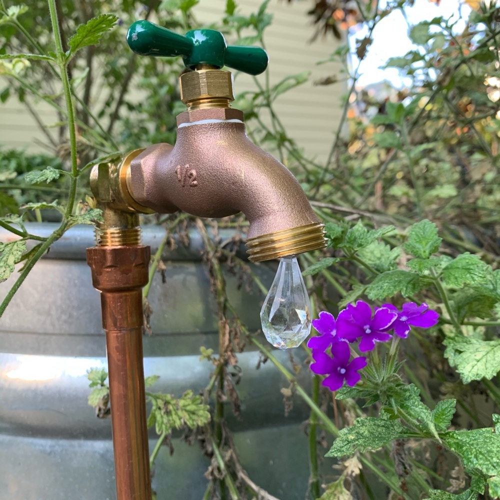Eclectic Yard Art - copper spigot with water drop